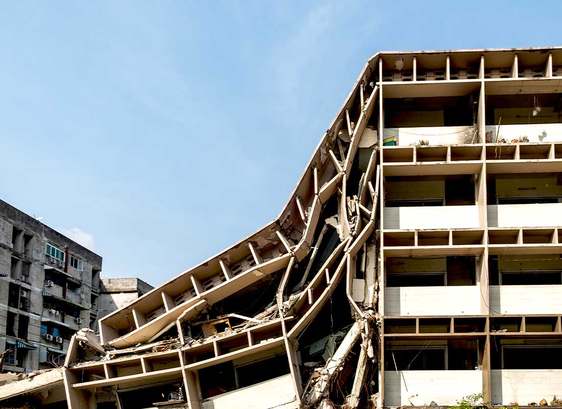 Commercial Earthquake Insurance - Collapsed Apartment Building after an Earthquake on a Warm Sunny Day
